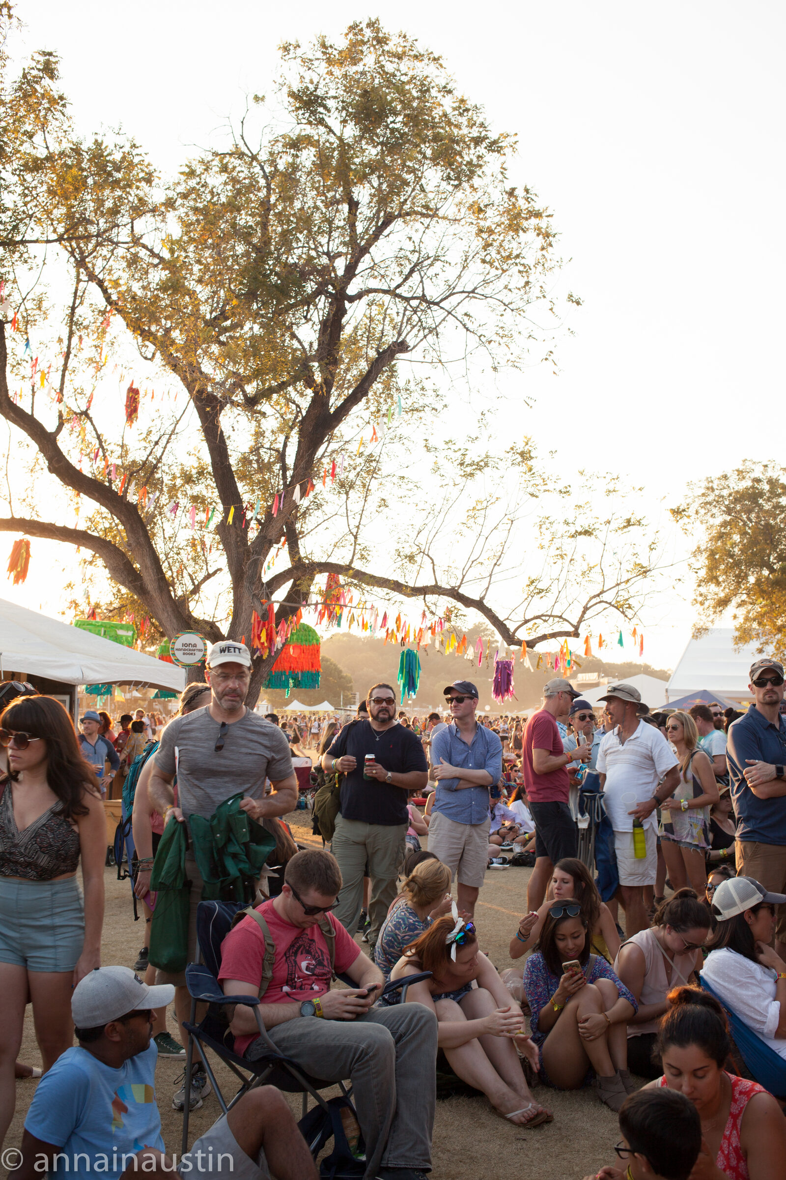 A festival crowd at Austin City Limits with phones held up in the air