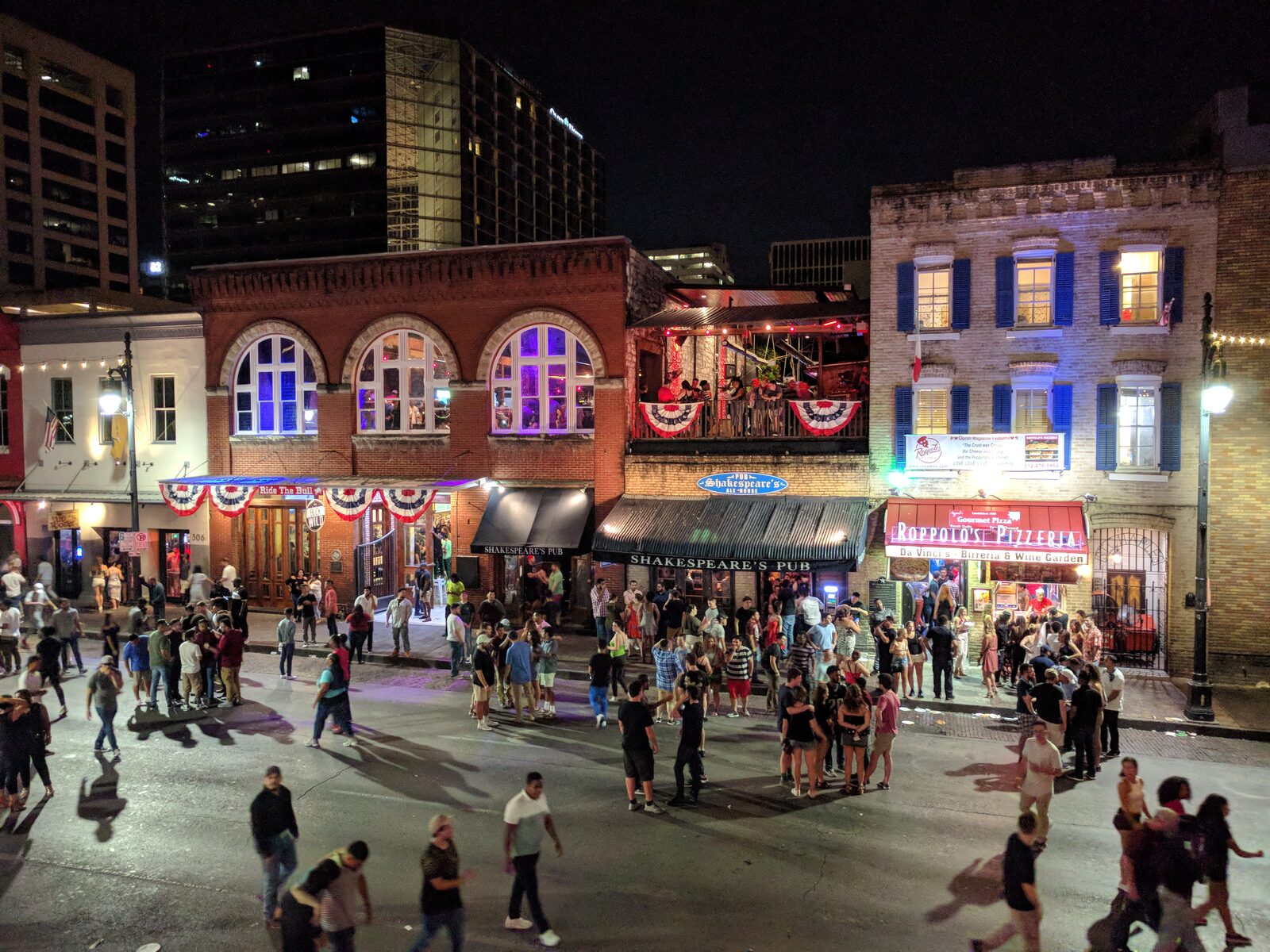 The neon of Sixth Street in downtown Austin at night
